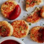 Crispy baked cauliflower tots with ketchup on the side.