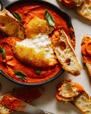 Fried burrata over romesco sauce with bread.