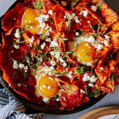 Shakshuka chilaquiles in a pan.