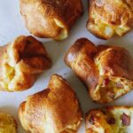 A close up of ham and cheese popovers.