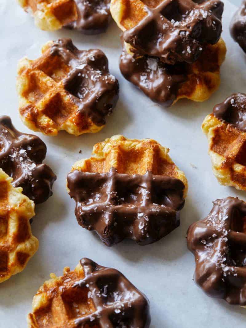 A close up of salted chocolate dipped liege waffles. 