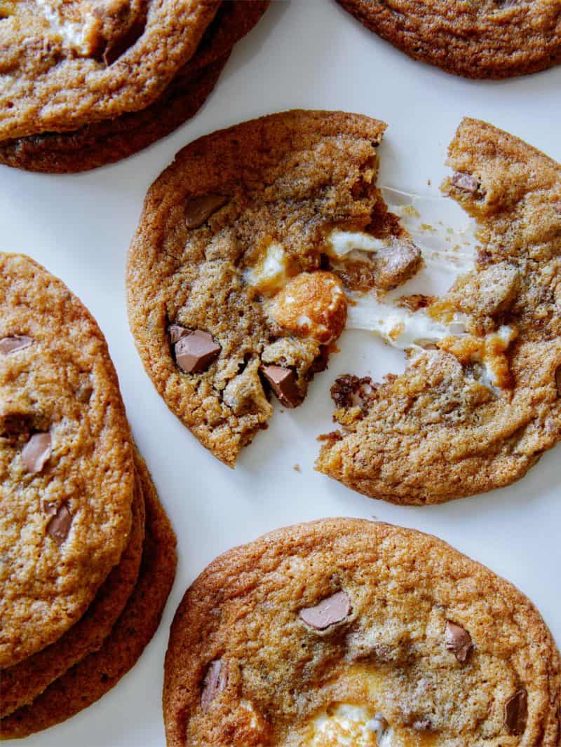 Marshmallow stuffed S'more cookies with one broken in half.