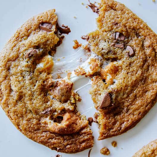 Close up on a S'mores cookie with marshmallow broken in half. 