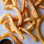 Churros with chocolate dipping sauce.