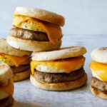 Stacked turkey sausage, egg and cheese breakfast sandwiches.