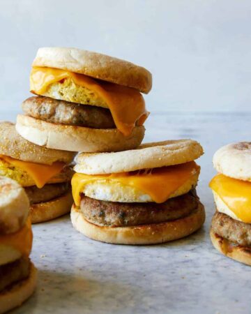 Stacked turkey sausage, egg and cheese breakfast sandwiches.