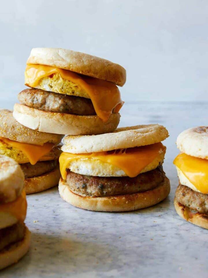 Stacked turkey sausage, egg and cheese breakfast sandwiches.