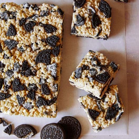 Cookies and cream rise kirspies treats being cut up into squares. 