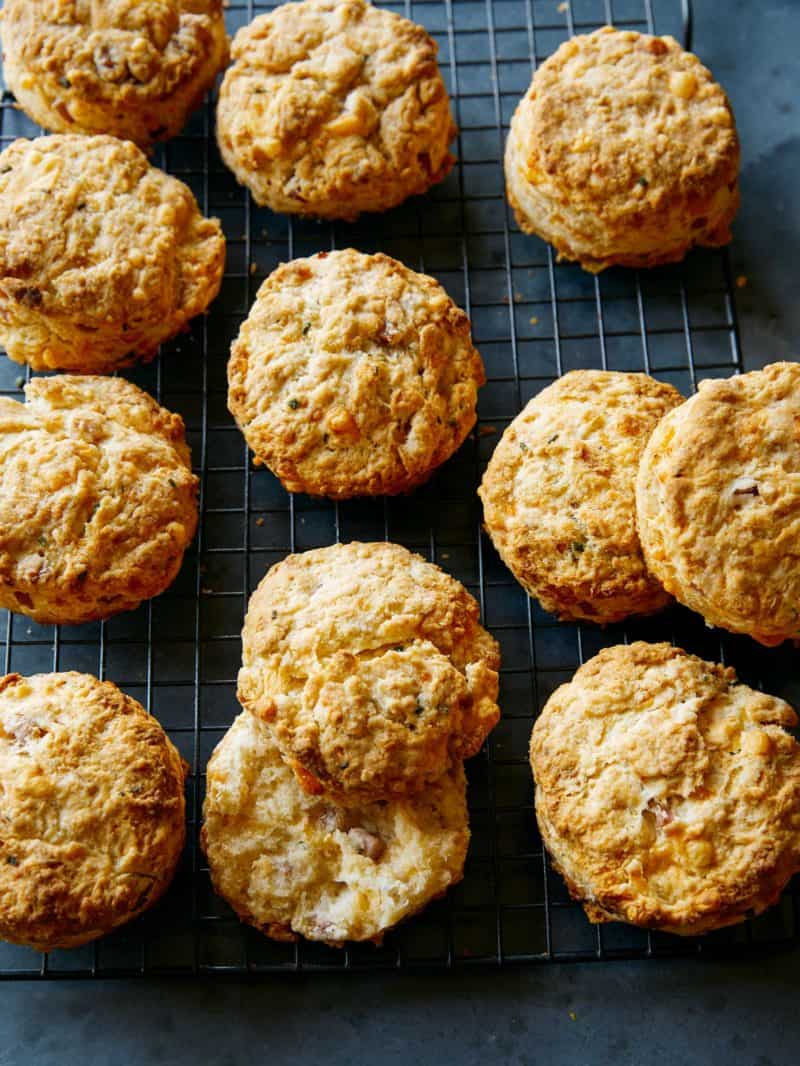 Ham and cheese buttermilk biscuits on a blue background.