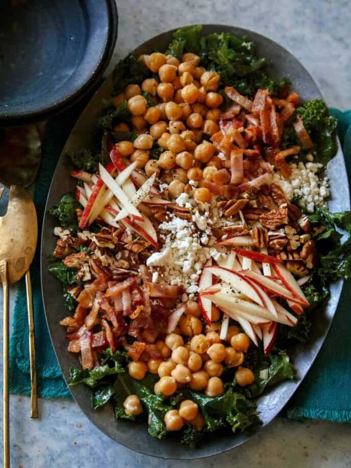 Platter of chicken kale apple and goat cheese salad.