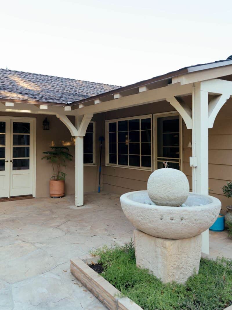 A patio with a close view of a fountain.