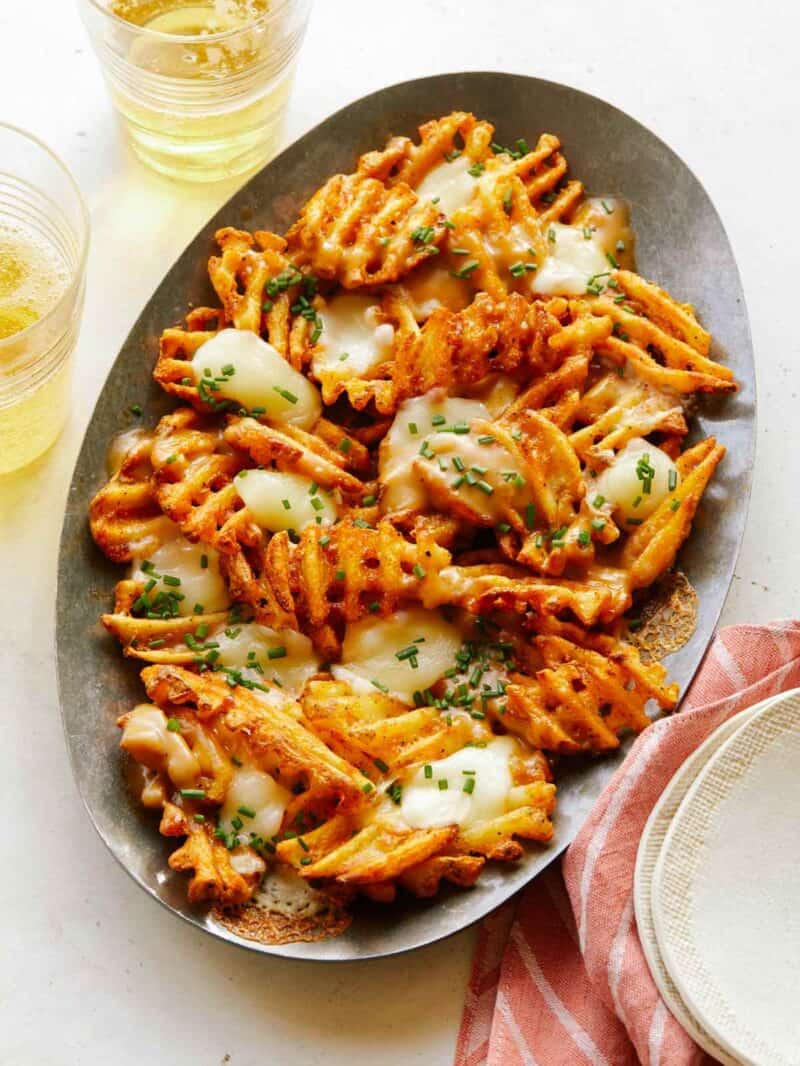 A Super Bowl finger food idea - a platter of poutine with waffle fries.