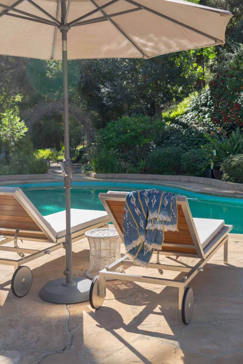 Chaise lounges by a pool.