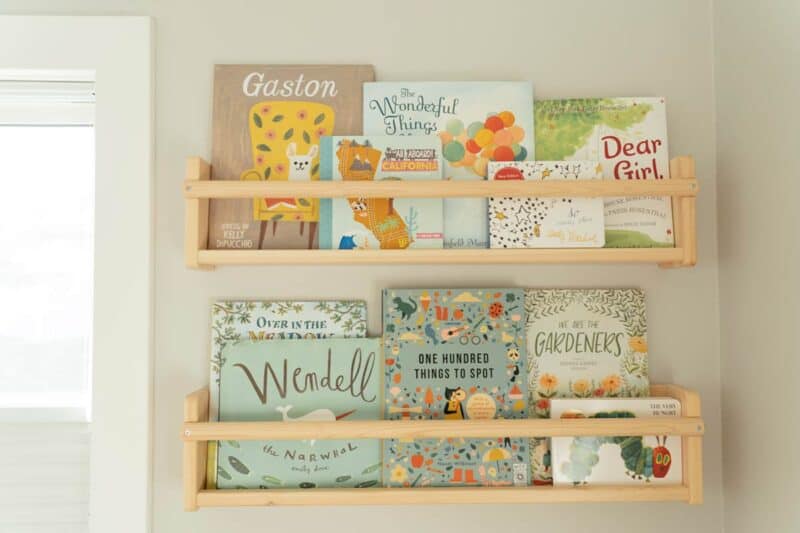 Nursery shelves with children\'s books.