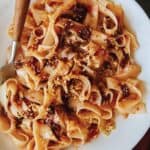 Chili oil garlic noodles on a plate with a fork.