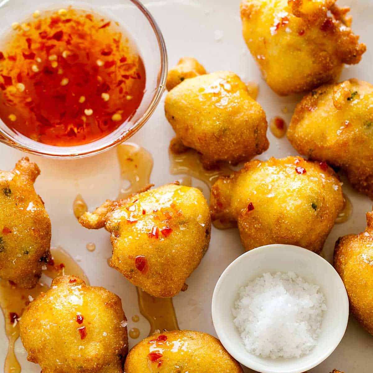 Hush puppies recipe with a sweet and spicy sauce.