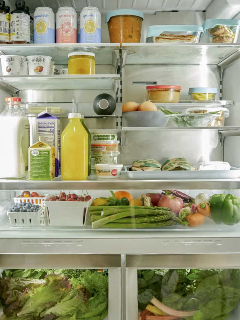 The inside of a refrigerator filled with food and drinks.