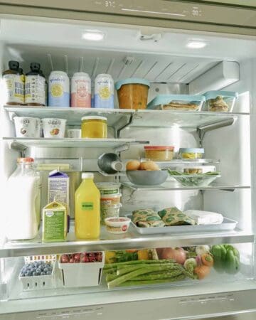 The inside of a refrigerator filled with food and drinks.