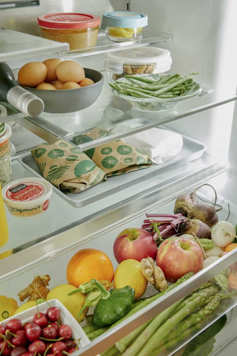 Refrigerator shelves with food.