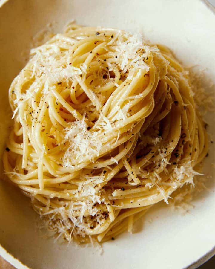 A close up of a swirled pile of cacio e pepe.