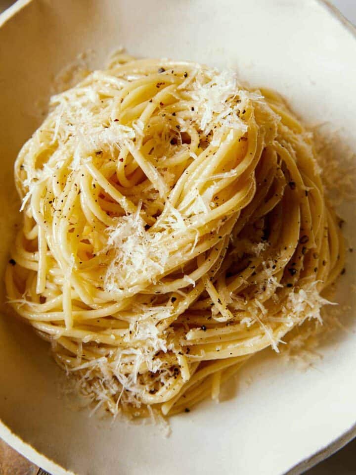 A close up of a swirled pile of cacio e pepe.