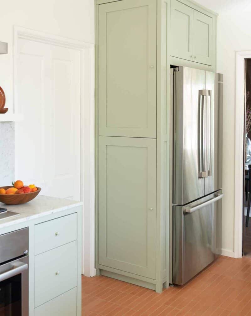 Refrigerator with cabinetry.