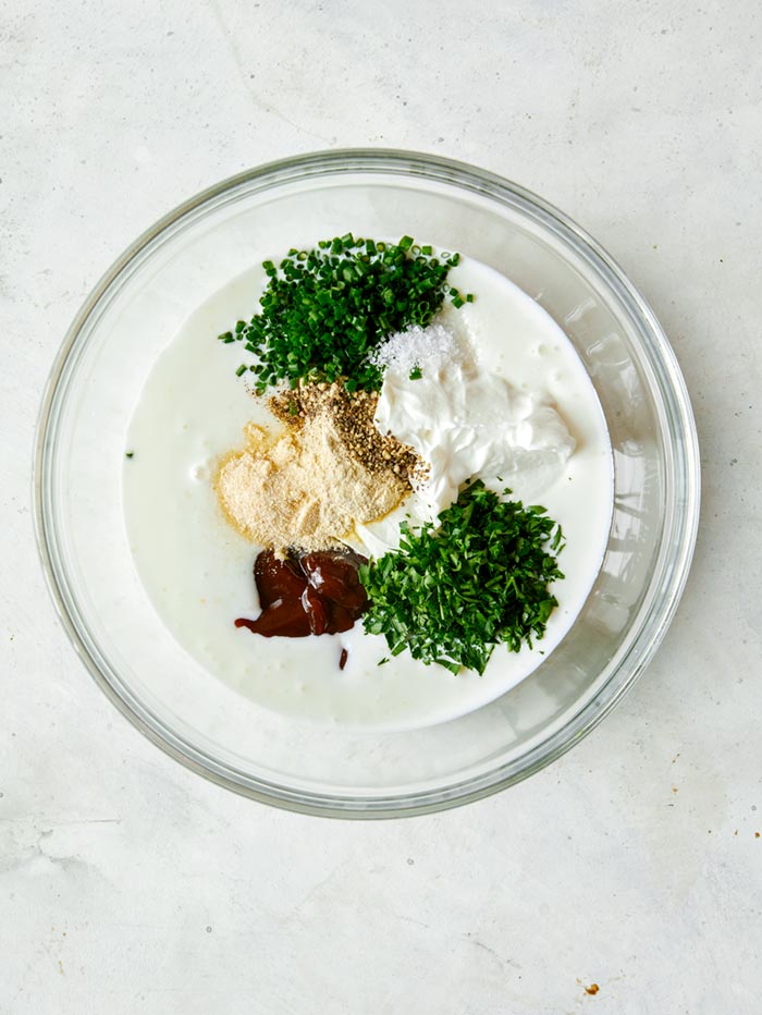 Ingredients for BBQ Yogurt Ranch Dressing in a bowl
