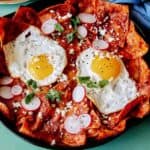 Chilaquiles in a skillet ready to be eaten.
