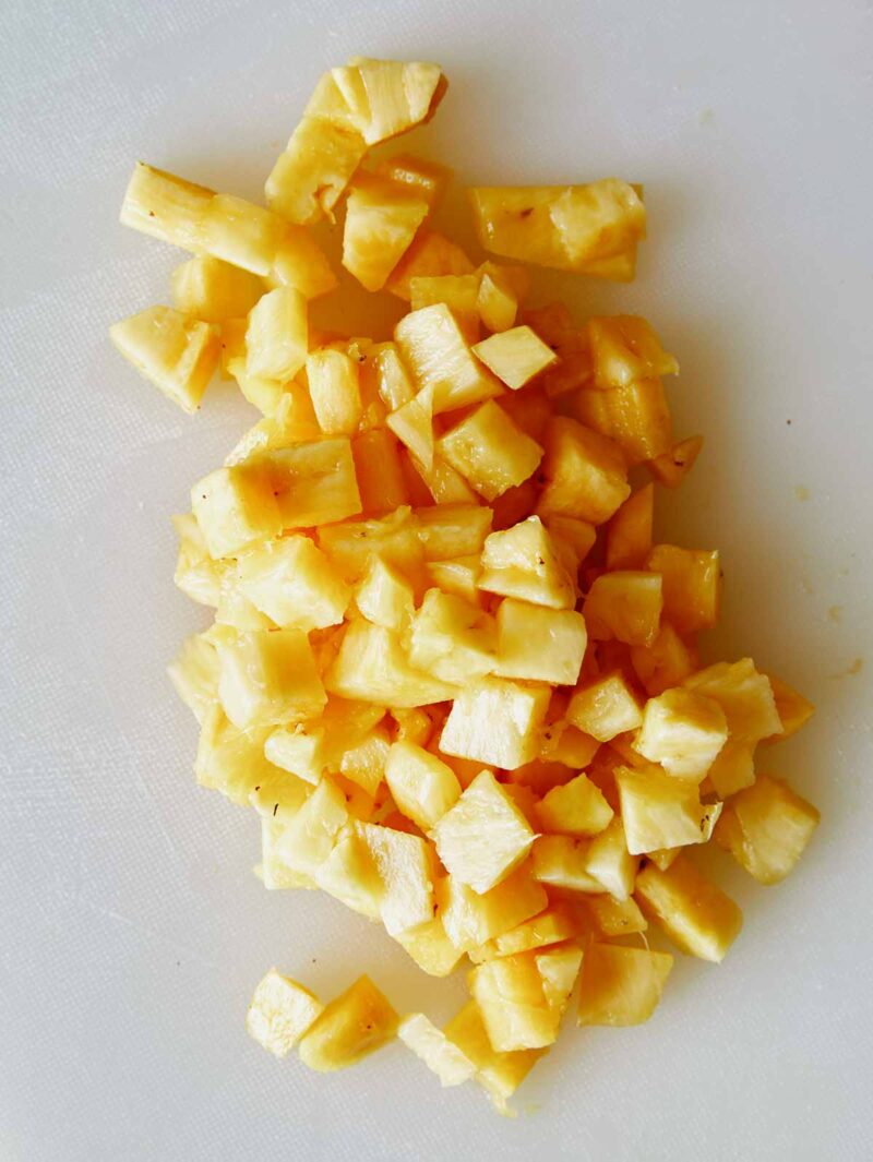 Diced pineapple for piña colada ice pops.