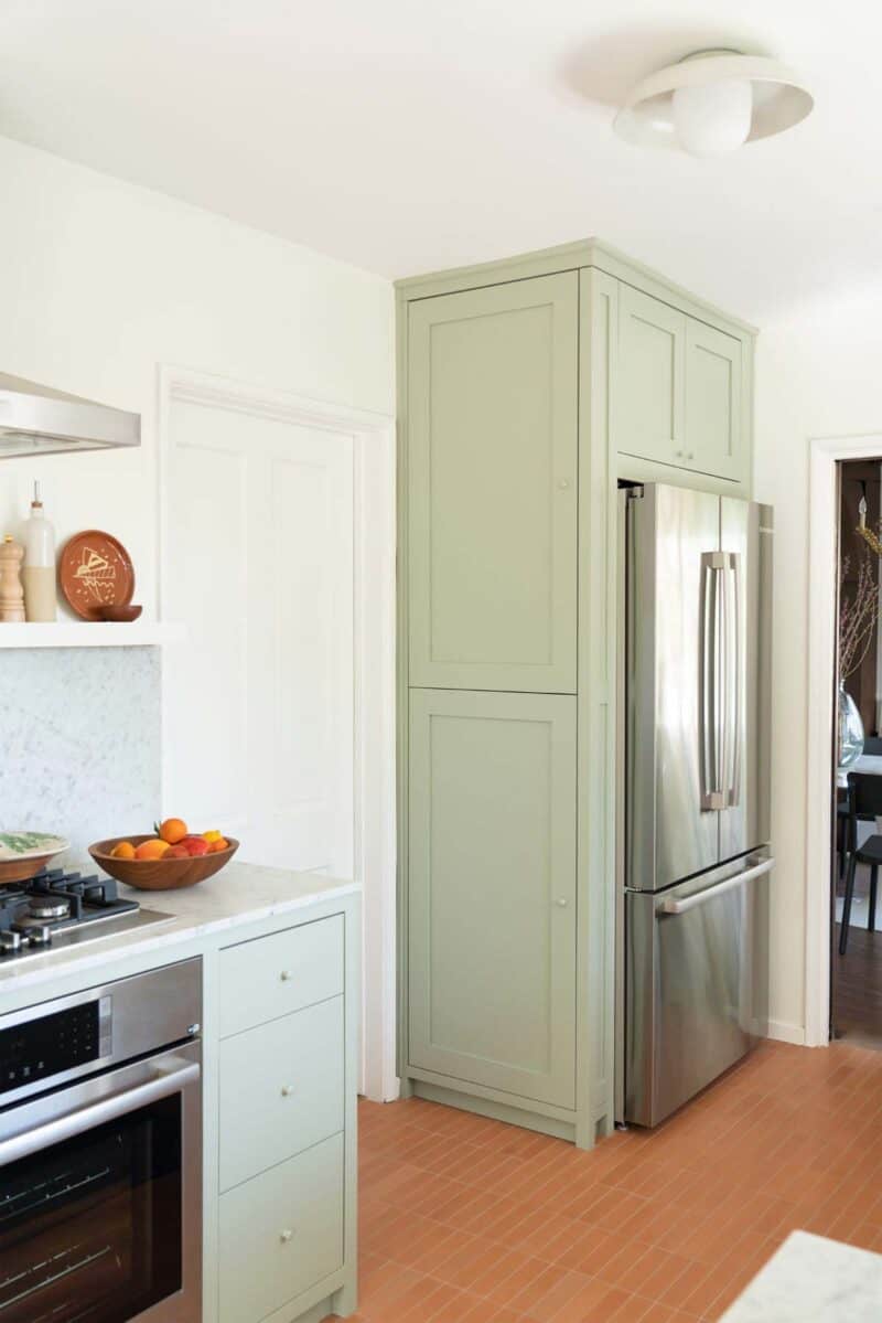 A newly remodeled kitchen with a view of a french door refrigerator. 