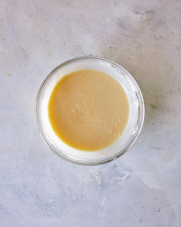 Wet batter mixed together in a bowl overhead.