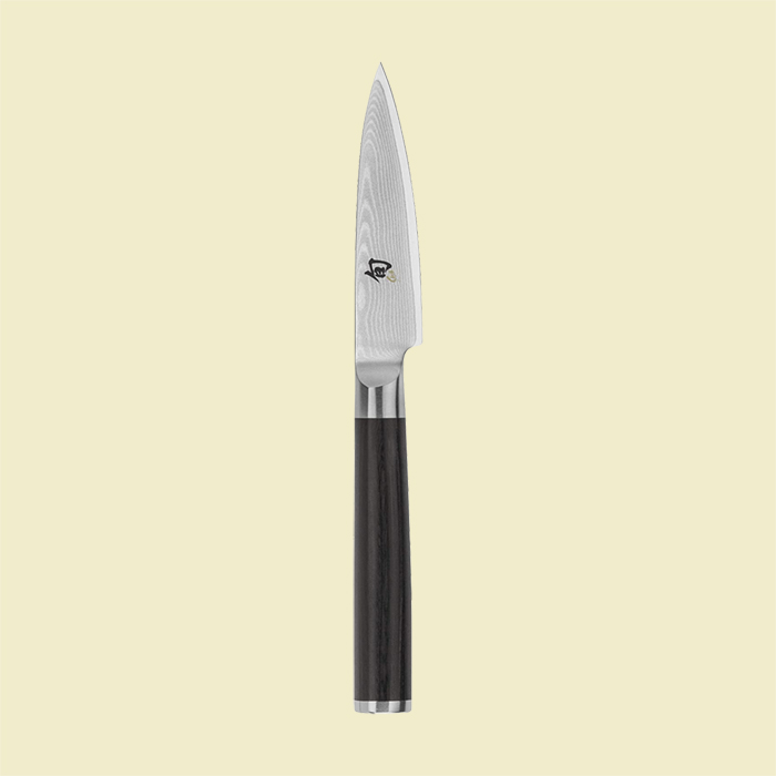 Black handled Shun pairing knife.