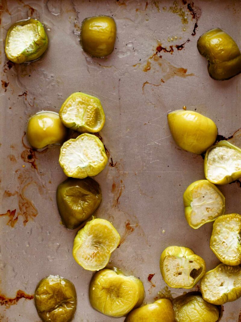 Roasted Tomatillos on a baking sheet to make tomatillo salsa.