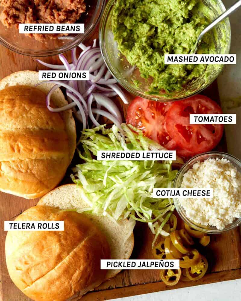 An image showing all the sandwich toppings for a carne asada torta. 