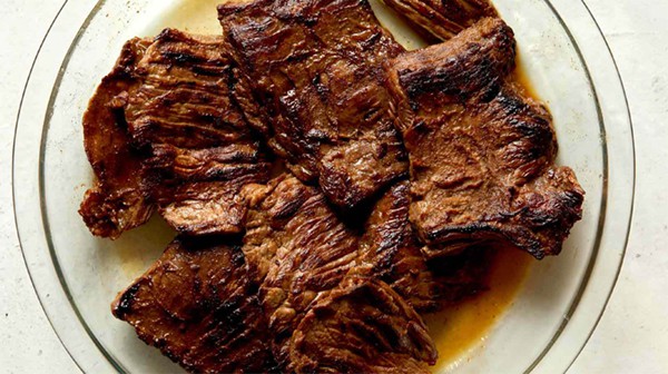 Freshly made and grilled carne asada in a dish.