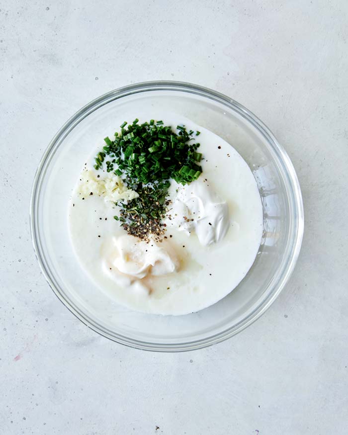 Buttermilk ranch dipping sauce ingredients in a bowl ready to mixed. 