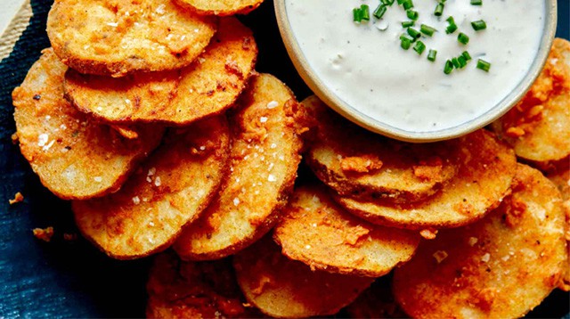 Chicken fried potatoes served with a ranch sauce.