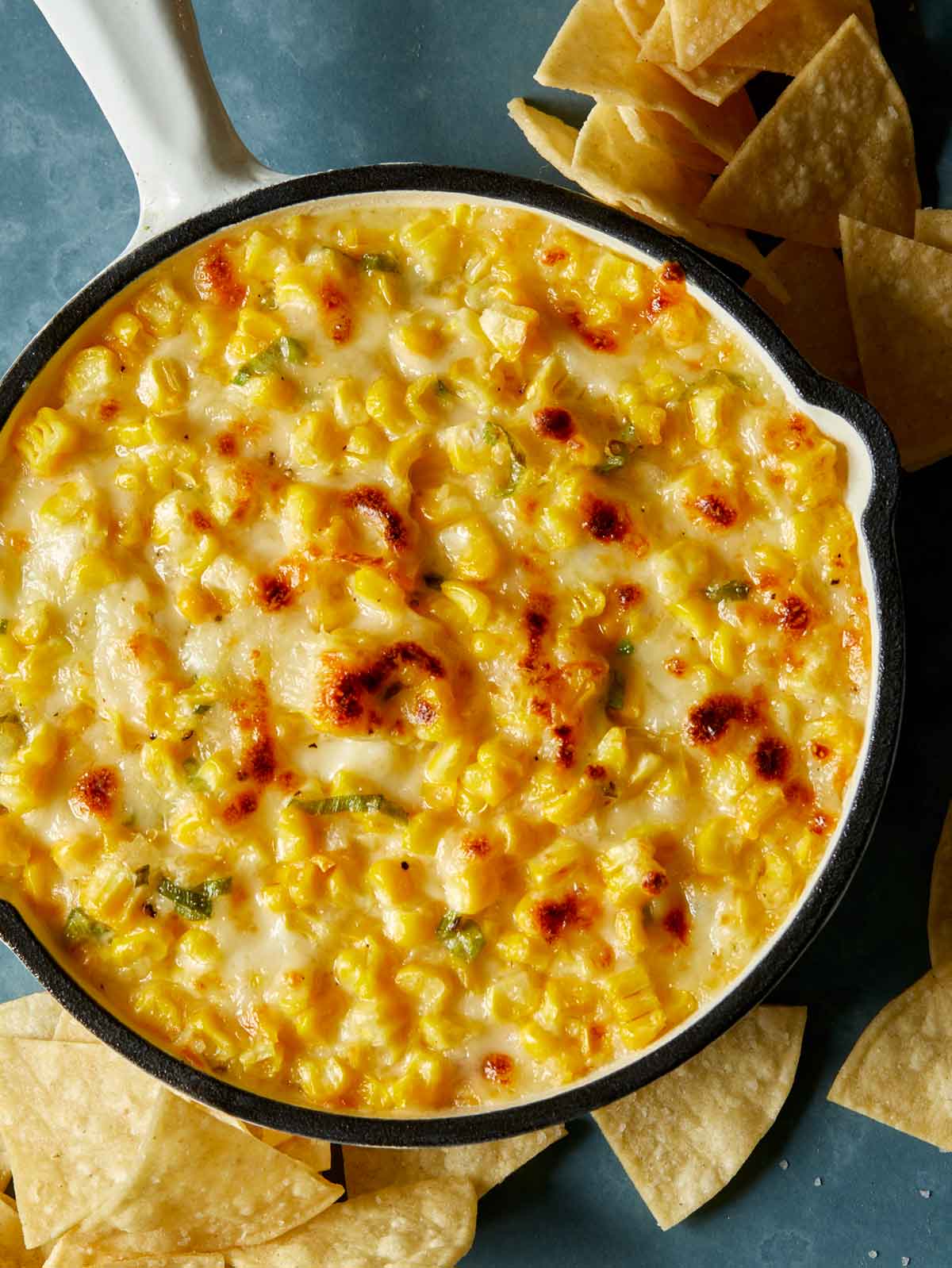 Korean Corn Cheese fresh out of the oven in a skillet overhead so you can see the crust on top. 