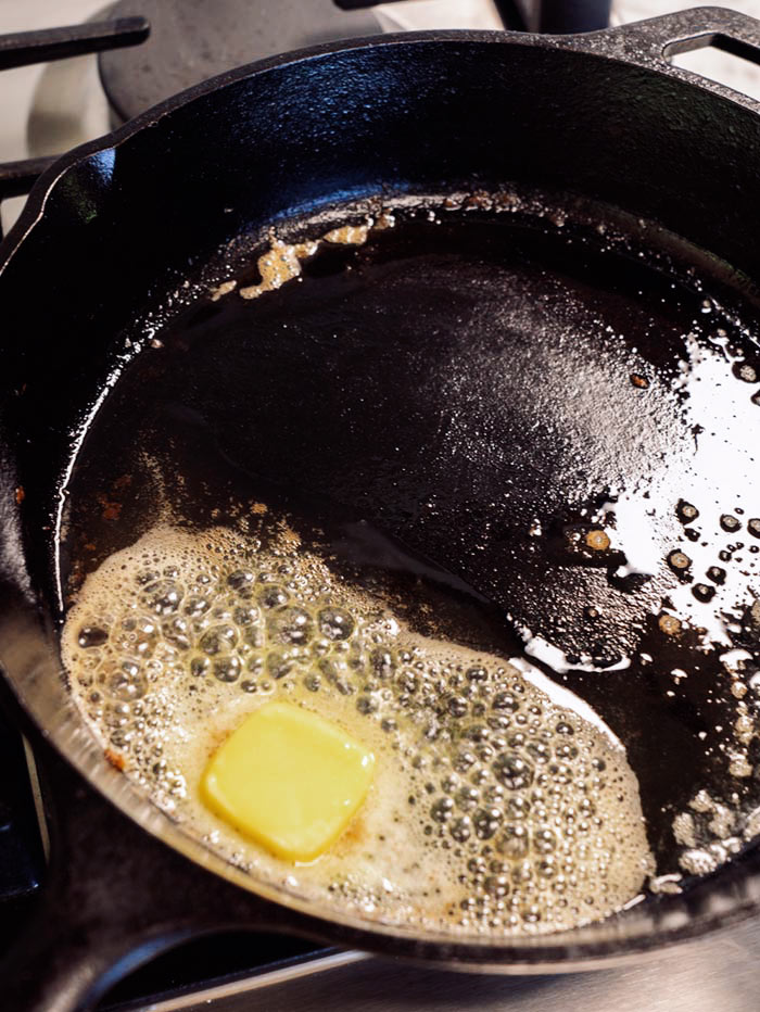 Butter melted in a skillet.