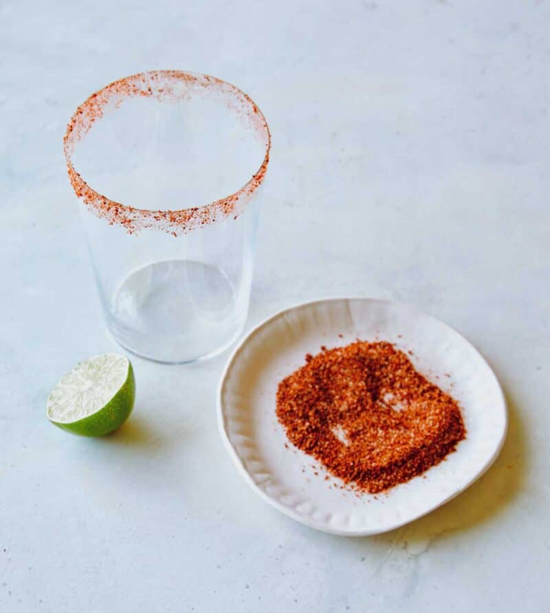 Chili lime seasoning on a plate to show how you rim a glass with it.
