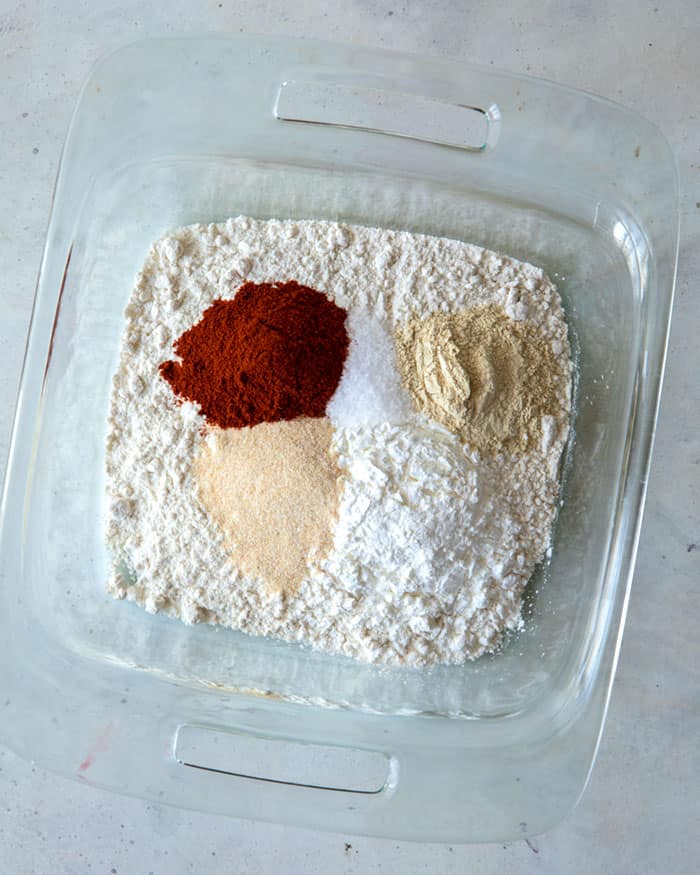 Chicken breading mixture in a glass bowl. 