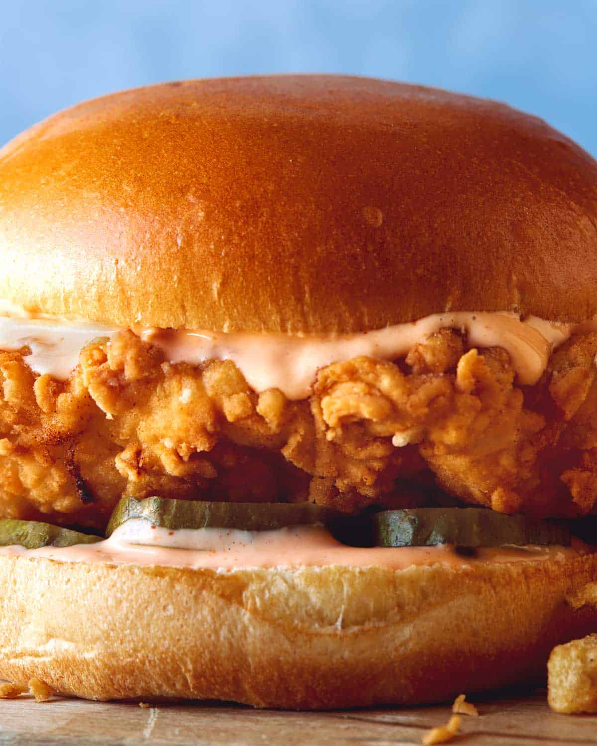 Popeyes fried chicken sandwich recipe up close looking into the side of the sandwich. 