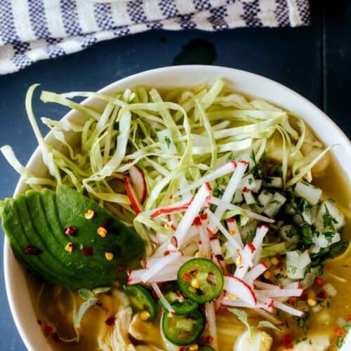 A close up of a bowl of pozole verde de pollo.