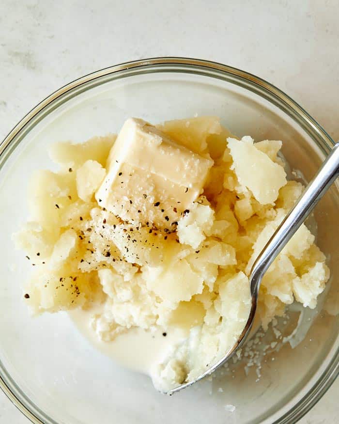 Mashed potatoes with butter and cream and salt and pepper on a bowl.