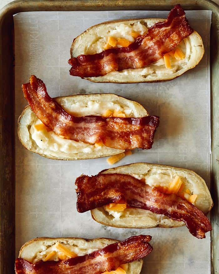 Bacon and cheese in potato halves. 
