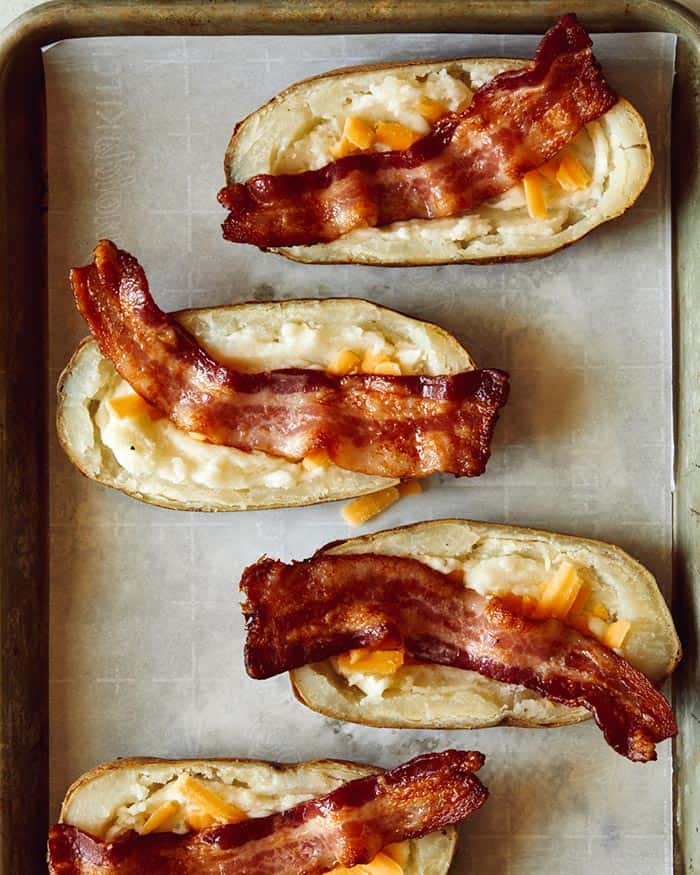 Bacon and cheese in potato halves.