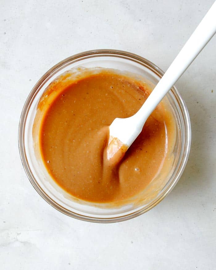 Chick fil a sauce whisked together in a glass bowl. 