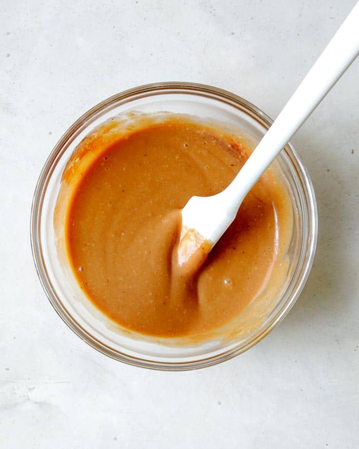 Chick fil a sauce whisked together in a glass bowl.