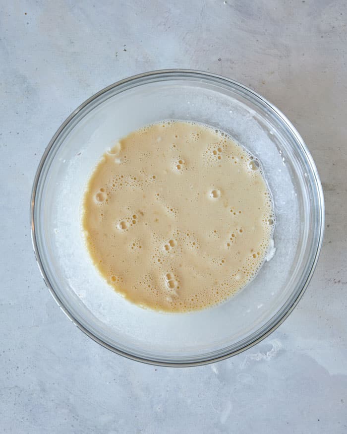 A bowl of batter mixed for sesame chicken.