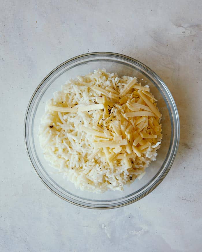 Hash brown ingredients in a mixing bowl. 
